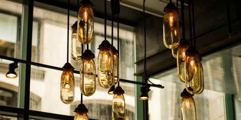 black pendant lamps with beige glass bulbs